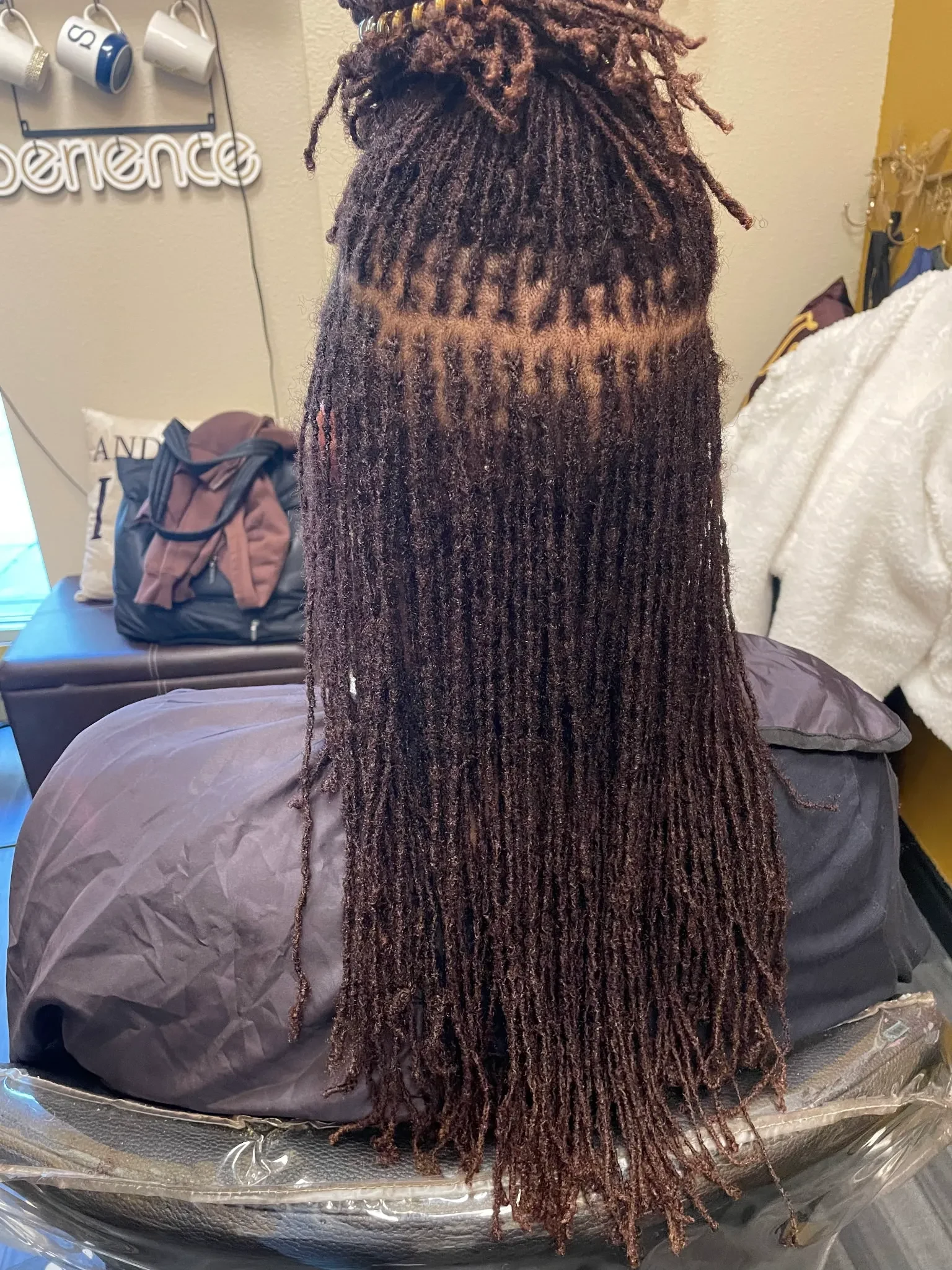 Original content — long microlocs photographed from behind