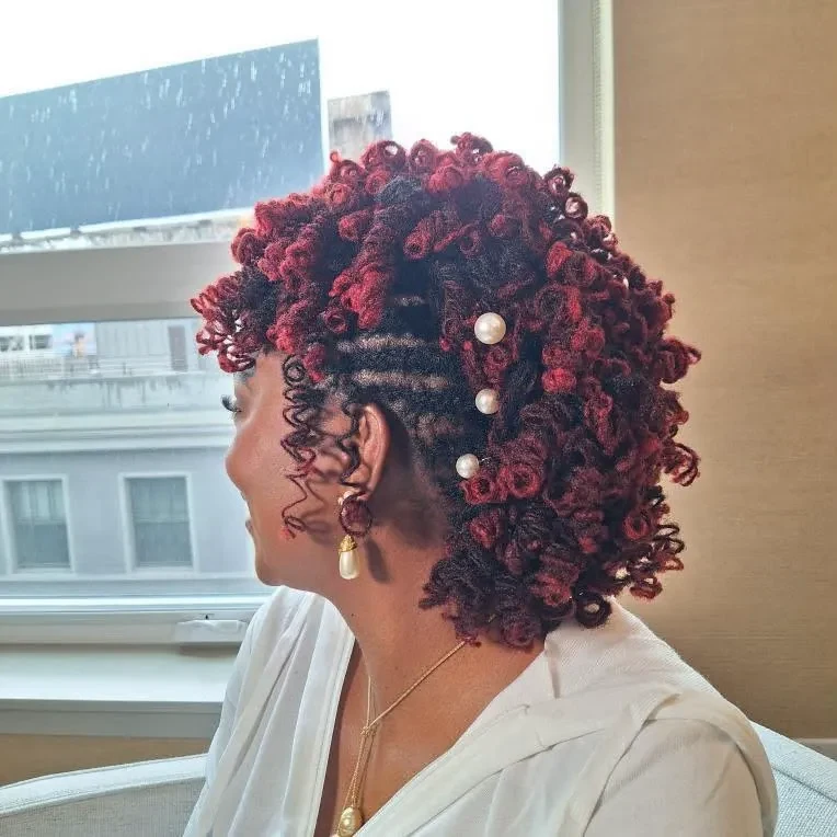 Original content — red curled loc updo with pearl details