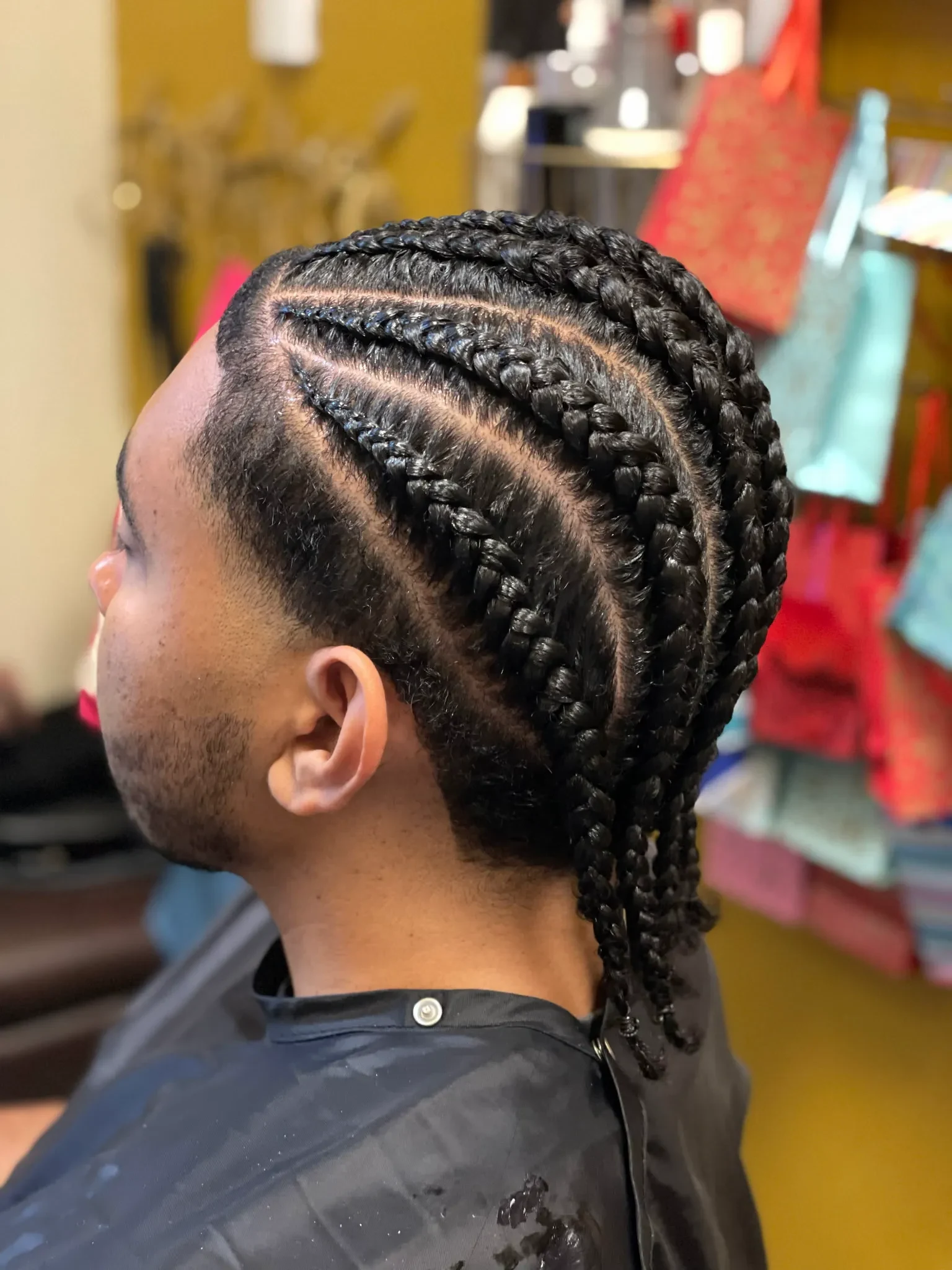 Original content — men's cornrows in a clean geometric pattern